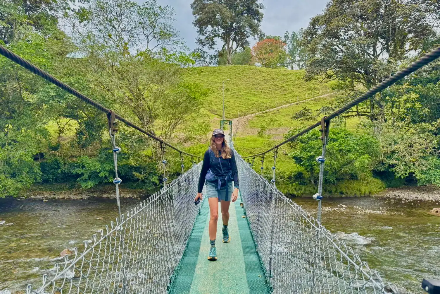 Hiking across the Pejibaye River on the Camino de Costa Rica